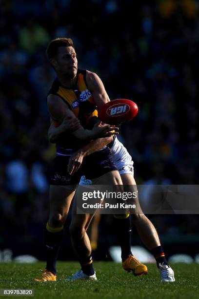 Sam MItchell of the Eagles handballs during the round 23 AFL match between the West Coast Eagles and the Adelaide Crows at Domain Stadium on August...