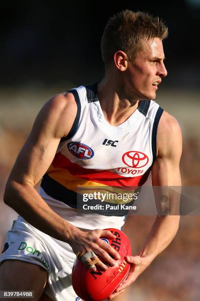 David Mackay of the Crows looks o pass the ball during the round 23 AFL match between the West Coast Eagles and the Adelaide Crows at Domain Stadium...