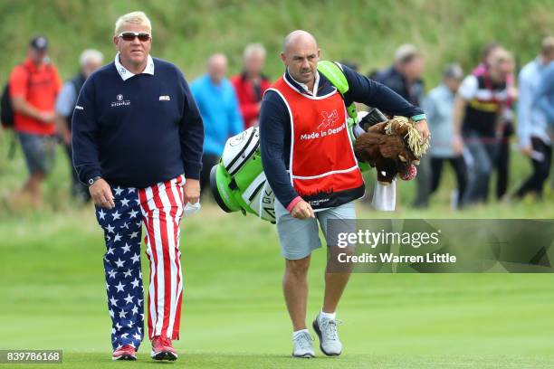 John Daly of the United States walks with caddie Simon Hurd on the 3rd hole during the final round of Made in Denmark at Himmerland Golf & Spa Resort...