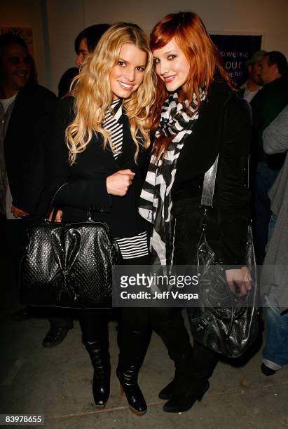Singers Jessica Simpson and Ashlee Simpson attend the gallery opening of "Without You I'm Just Me" held at Gallery 1988 on December 9, 2008 in West...