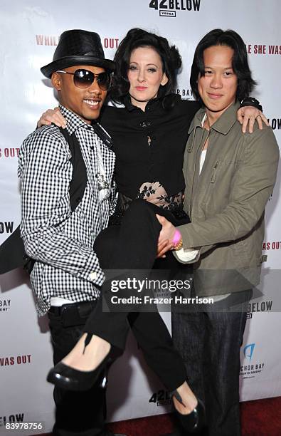 Actors Jamie Starr , and Leonard Wu, hold Susan Montford, director at the premiere Of Anchor Bay Entertainment's "While She Was Out" on December9,...