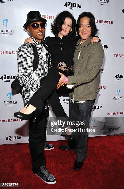 Actors Jamie Starr, and Leonard Wu, hold Susan Montford, director at the premiere Of Anchor Bay Entertainment's "While She Was Out" on December9,...