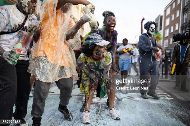 Paint-covered revellers take part in the traditional "J'ouvert" opening parade of the Notting Hill carnival on August 27, 2017 in London, England.