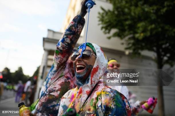 Paint-covered revellers take part in the traditional "J'ouvert" opening parade of the Notting Hill carnival on August 27, 2017 in London, England.