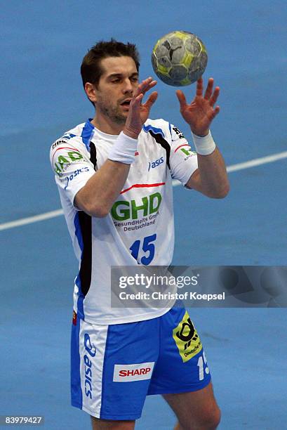 Guillaume Gille of Hamburg passes the ball during the Handball Bundesliga match between VfL Gummersbach and HSV Hamburg THW Kiel at the Lanxess Arena...