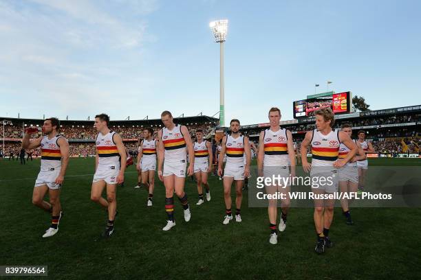 The Crows leave the field after the teams defeat during the round 23 AFL match between the West Coast Eagles and the Adelaide Crows at Domain Stadium...