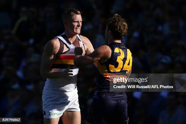 Alex Keath of the Crows wrestles with Mark Hutchings of the Eagles during the round 23 AFL match between the West Coast Eagles and the Adelaide Crows...