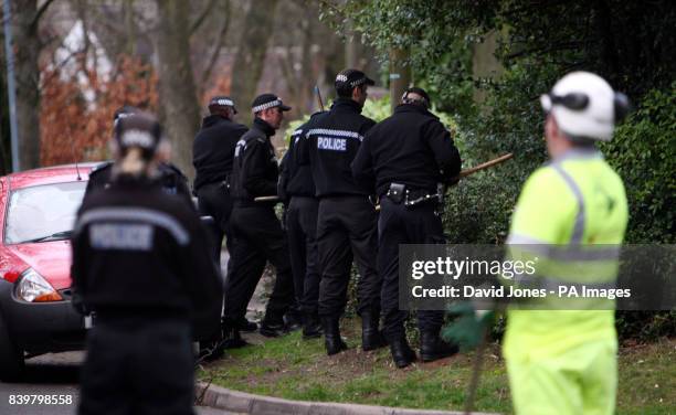 Police search the area around the house in Handsworth Wood, Birmingham, where the bodies of Avtar and Carole Kolar were discovered this morning,...