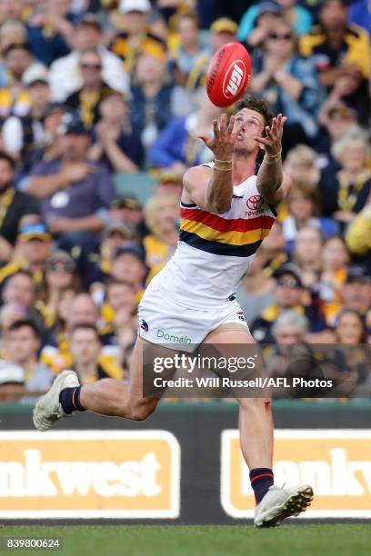 Kyle Hartigan of the Crows marks the ball during the round 23 AFL match between the West Coast Eagles and the Adelaide Crows at Domain Stadium on...