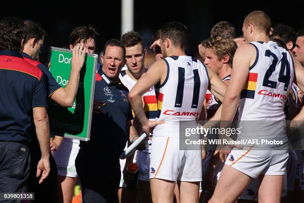 Don Pyke, Senior Coach of the Crows, addresses the players at the quarter time break during the round 23 AFL match between the West Coast Eagles and...