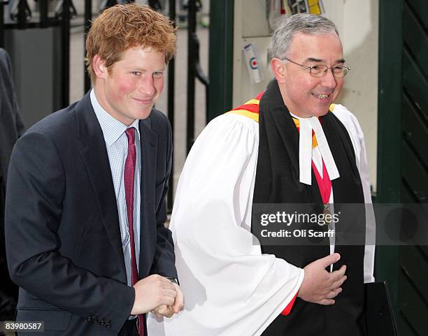 Prince Harry is greeted by The Very Reverend Dr John Hall, the Dean of Westminster, as he arrives at a service to honor the "Woman's Own Children of...