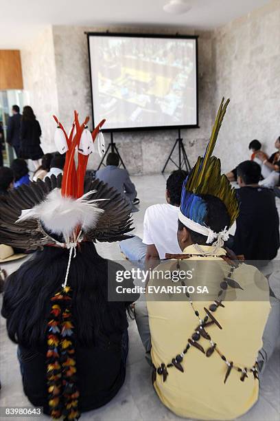 Brazilian natives from several tribes attend a projection on a screen of the trial on the Raposa Serra do Sol indigenous reservation in the Supreme...