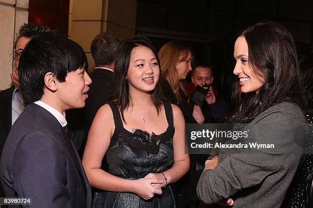 Bee Vang, Ahney Her, and Angelina Jolie arrive on the red carpet for the Los Angeles premiere of "Gran Torino" at the Steven J. Ross Theater on The...