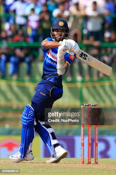 Sri Lankan cricketer Dinesh Chandimal plays a shot during the 3rd One Day International cricket match between Sri Lanka and India at the Pallekele...