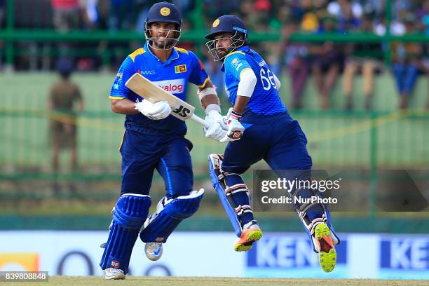 Sri Lankan cricketer Dinesh Chandimal and Lahiru Thirimanne run between the wickets during the 3rd One Day International cricket match between Sri...