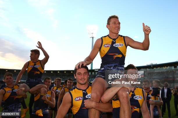 Drew Petrie of the Eagles is chaired from the ground after winning the round 23 AFL match between the West Coast Eagles and the Adelaide Crows at...