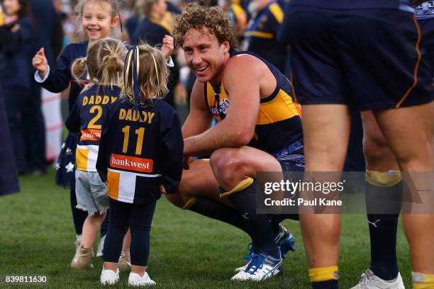 Matt Priddis of the Eagles shares a moment with his daughter after winning the round 23 AFL match between the West Coast Eagles and the Adelaide...