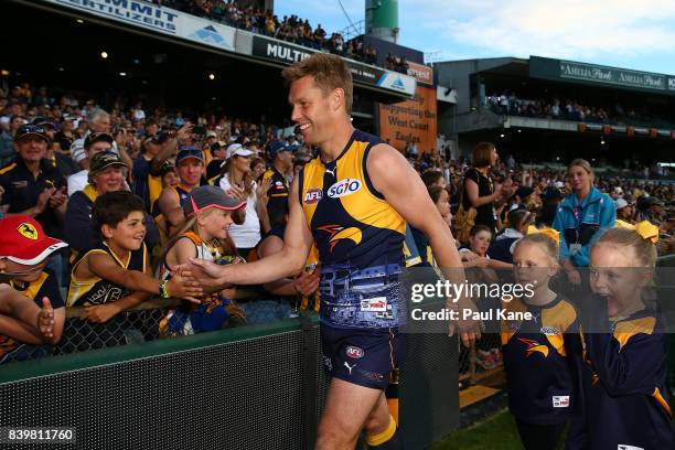 Sam MItchell of the Eagles high fives spectators after winning the round 23 AFL match between the West Coast Eagles and the Adelaide Crows at Domain...