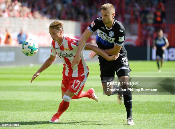 Steven Skrzybski of 1 FC Union Berlin and Florian Hartherz of Arminia Bielefeld during the game between germany and france on august 27, 2017 in...