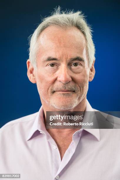 British author and radio/television presenter Martin Sixsmith attends a photocall during the annual Edinburgh International Book Festival at...