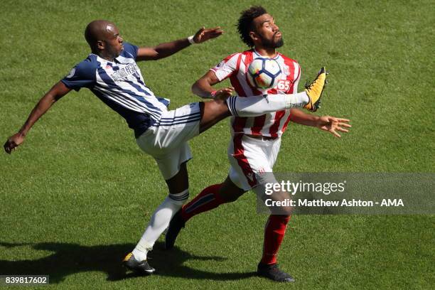 Allan-Romeo Nyom of West Bromwich Albion and Eric Maxim Choupo-Moting of Stoke City during the Premier League match between West Bromwich Albion and...