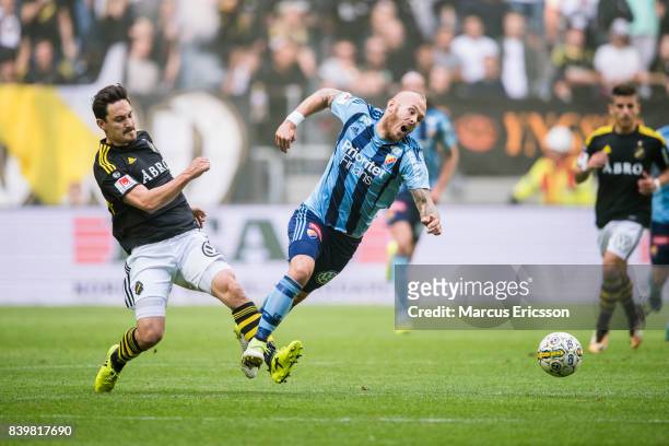 Stefan Ishizaki of AIK and Magnus Eriksson of Djurgardens IF during the Allsvenskan match between AIK and Djurgardens IF at Friends arena on August...
