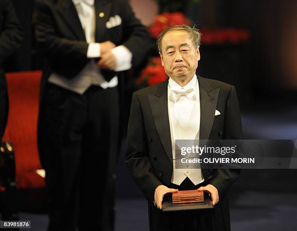 Nobel physics prize laureate Makoto Kobayashi of Japan receives his award in Stockholm on December 10, 2008. Nobel laureates all receive a gold medal...