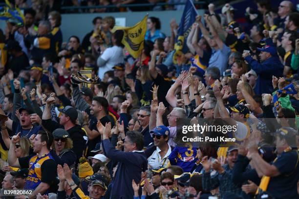 Eagles fans celebrate a goal during the round 23 AFL match between the West Coast Eagles and the Adelaide Crows at Domain Stadium on August 27, 2017...