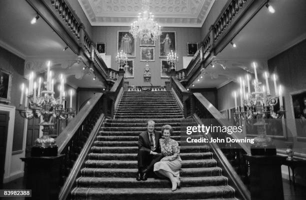 John Spencer, 8th Earl Spencer with his second wife Raine, Countess Spencer at Althorp, the family seat in Northamptonshire, December 1986.