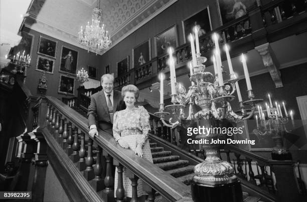 John Spencer, 8th Earl Spencer with his second wife Raine, Countess Spencer at Althorp, the family seat in Northamptonshire, December 1986.
