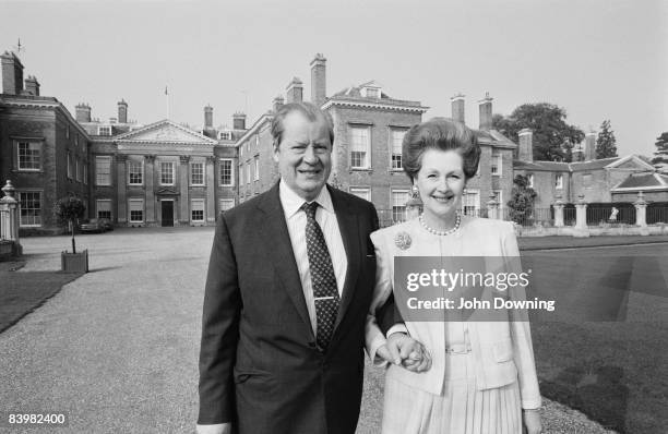 John Spencer, 8th Earl Spencer with his second wife Raine, Countess Spencer at Althorp, the family seat in Northamptonshire, December 1986.