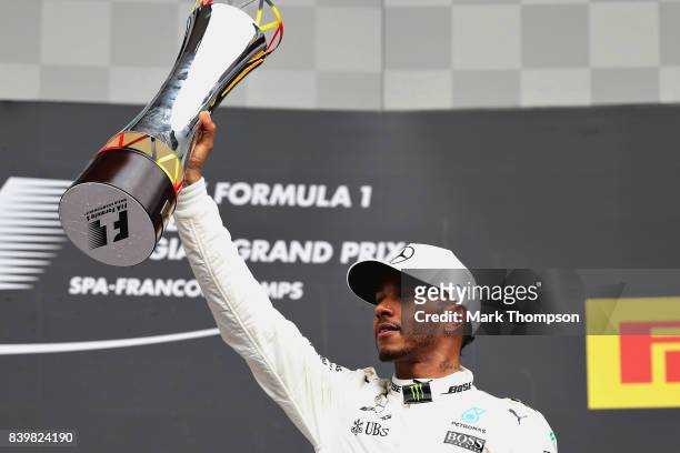Race winner Lewis Hamilton of Great Britain and Mercedes GP celebrates on the podium during the Formula One Grand Prix of Belgium at Circuit de...