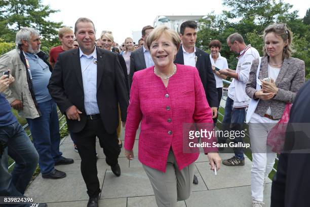 German Chancellor Angela Merkel greets visitors during the annual open-house day at the Chancellery on August 27, 2017 in Berlin, Germany. Germany...