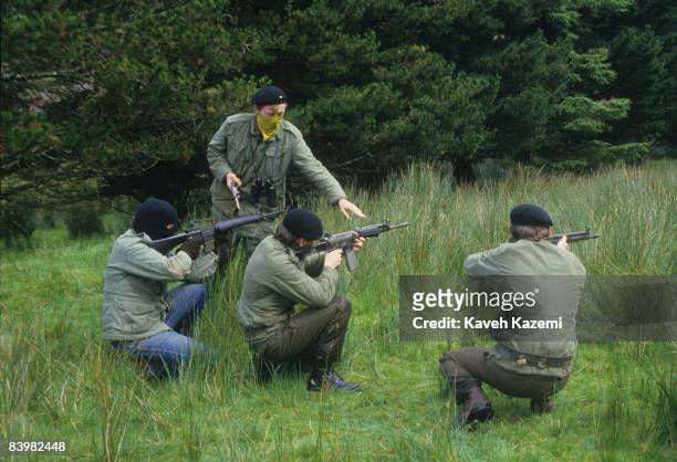 Trainee members of the Provisional Irish Republican Army practice guerilla warfare tactics in a secret location in the countryside possibly near the...