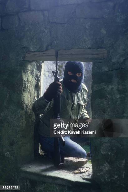 Trainee member of the Provisional Irish Republican Army during an armed assault practice on the ruins of a building in a secret location in the...