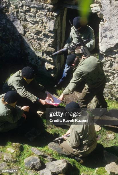 Trainee members of the Provisional Irish Republican Army familiarize themselves with assault tactics in a ruined building in a secret location in the...