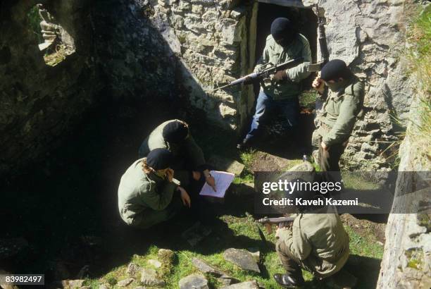 Trainee members of the Provisional Irish Republican Army familiarize themselves with assault tactics in a ruined building in a secret location in the...