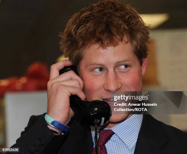 Prince Harry closes a deal over the phone at the offices of city traders ICAP on December 10, 2008 in London, England. The Prince attended the 16th...