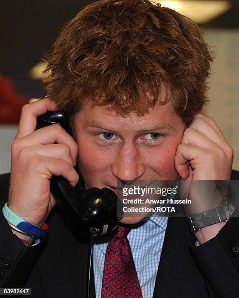 Prince Harry closes a deal over the phone at the offices of city traders ICAP on December 10, 2008 in London, England. The Prince attended the 16th...
