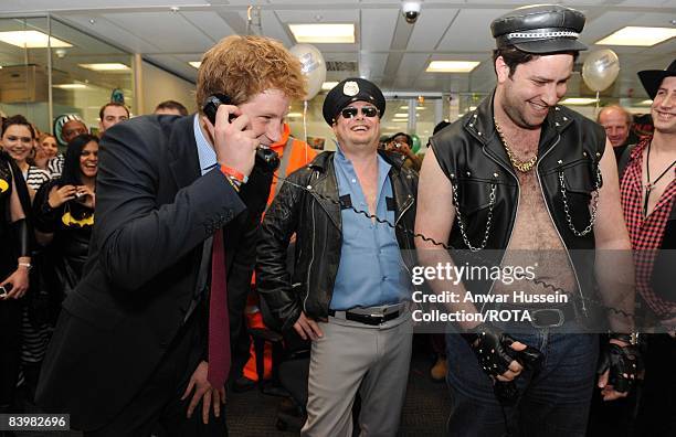 Prince Harry closes a deal with brokers at the offices of city traders ICAP on December 10, 2008 in London, England. The Prince attended the 16th...