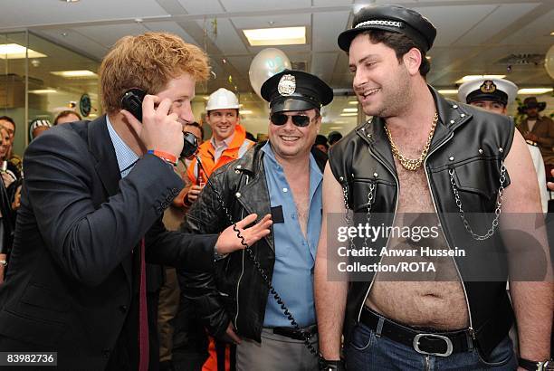 Prince Harry closes a deal with broker Jay Aaronson at the offices of city traders ICAP on December 10, 2008 in London, England. The Prince attended...