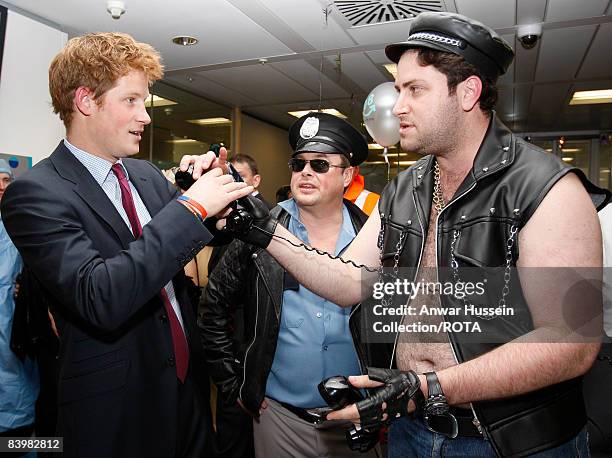 Prince Harry meets Jay Aaronson and fellow brokers at the offices of city traders ICAP on December 10, 2008 in London, England. The Prince attended...