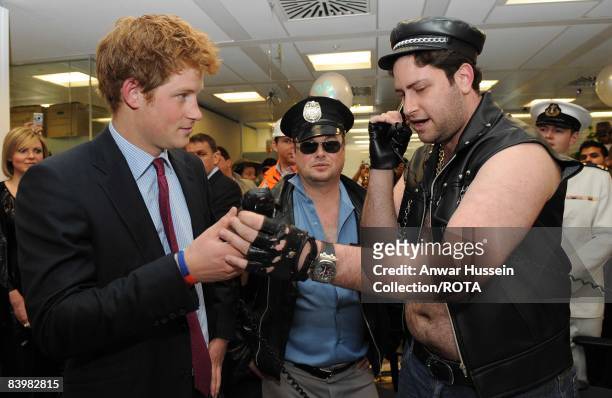 Prince Harry meets Jay Aaronson and fellow brokers at the offices of city traders ICAP on December 10, 2008 in London, England. The Prince attended...