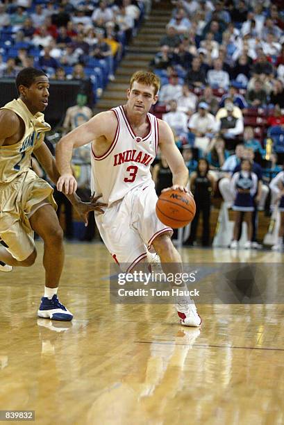 Guard Tom Coverdale of the Indiana Hoosiers brings the ball up the court against the UNC-Wilmington Seahawks during the second round of the 2002 NCAA...