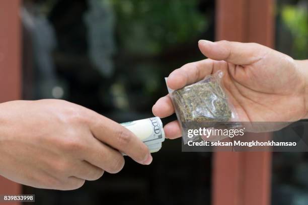 drug addict buying narcotics and paying - drug delivery ストックフォトと画像