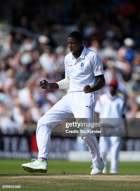 West Indies bowler Jason Holder celebrates after dismissing Alastair Cook during day three of the 2nd Investec Test match between England and West...