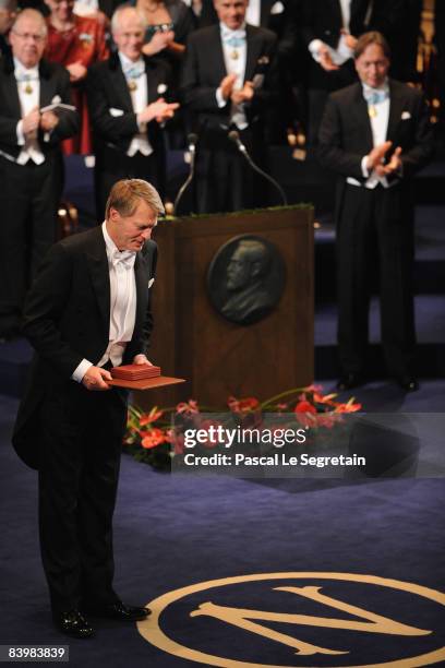 French writer Jean-Marie Gustave Le Clezio bows as he receives the 2008 Nobel Prize in Literature during the Nobel Foundation Prize 2008 Awards...