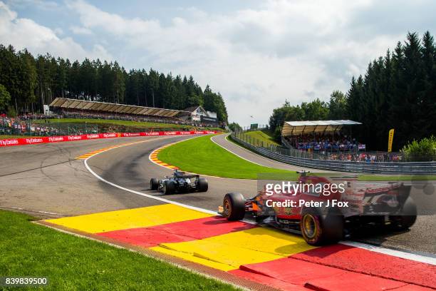 Lewis Hamilton of Mercedes and Great Britain leads Sebastian Vettel of Ferrari and Germany at the restart during the Formula One Grand Prix of...
