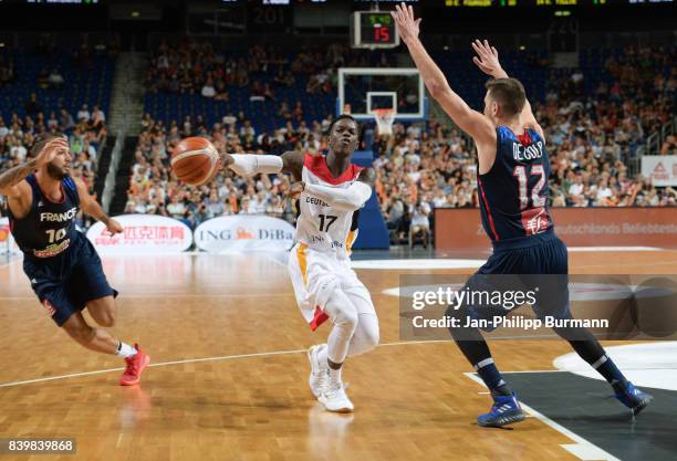 Evan Fournier of Team Frankreich, Dennis Schroeder of Team Germany and Nando De Colo of Team Frankreich during the game between Germany and France on...