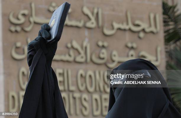 Fatiha Houssaini, wife of jailed Salafist, Omar Maarouf protests outside the headquarters of the council of human rights in Casablanca in Rabat on...